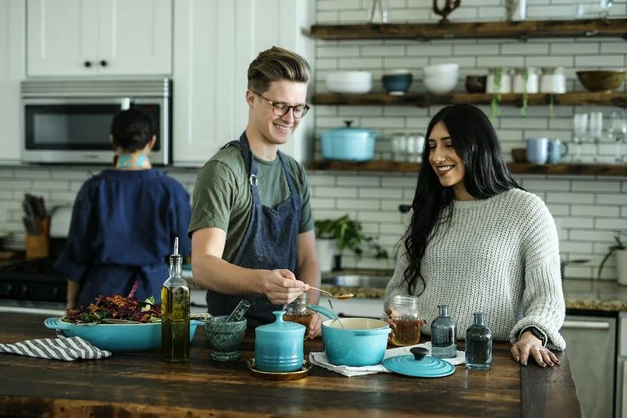 Couple cooking dinner together in their kitchen